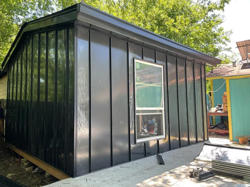 Black standing seam metal wall panels for Metal Roof Installation in Kirtland